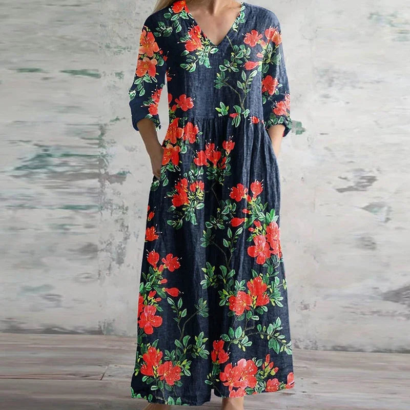 Floral maxi dress with V-neck and three-quarter sleeves, dark base with red blooms