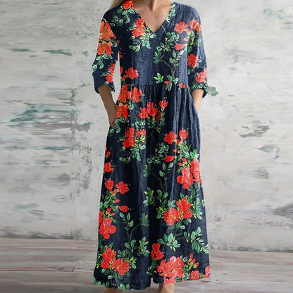 Floral maxi dress with V-neck and three-quarter sleeves, dark base with red blooms