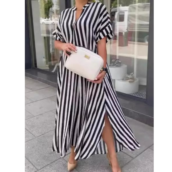 Black-and-white striped maxi dress with V-neck, short flutter sleeves, and front slit