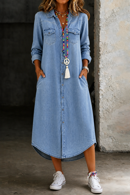 Light blue denim shirt dress with curved high-low hem, button-front and chest pockets.