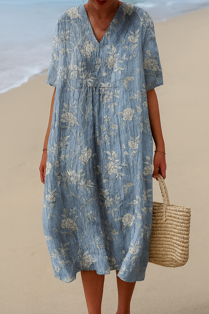 Light blue floral midi dress with V-neck, short sleeves, gathered waist