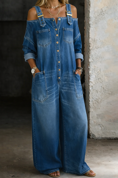 Blue off-shoulder denim jumpsuit with button placket and front patch pockets, rolled sleeves.
