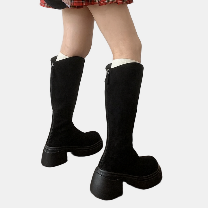 Black high boots with white sock cuffs, suede-look upper, chunky sole and block heel