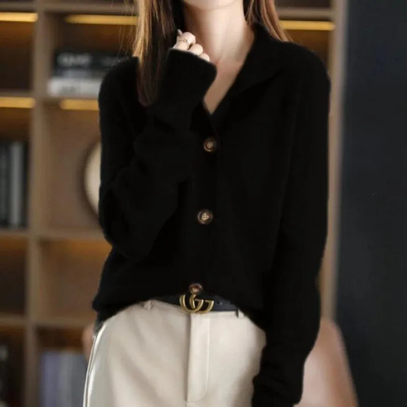 Black buttoned knit sweater with long sleeves and front buttons