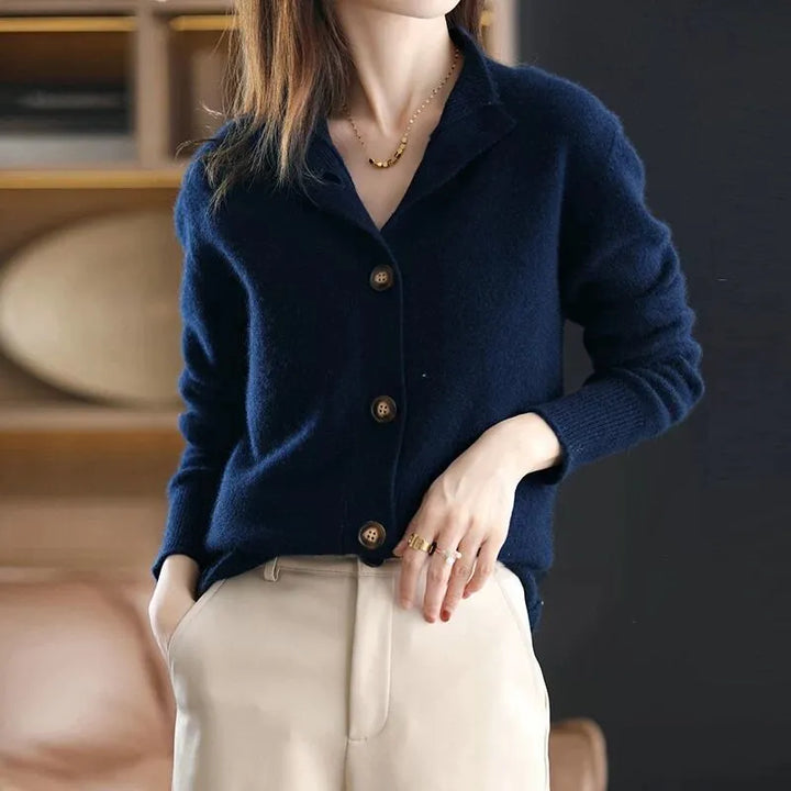 Dark blue buttoned knit sweater with long sleeves and front buttons