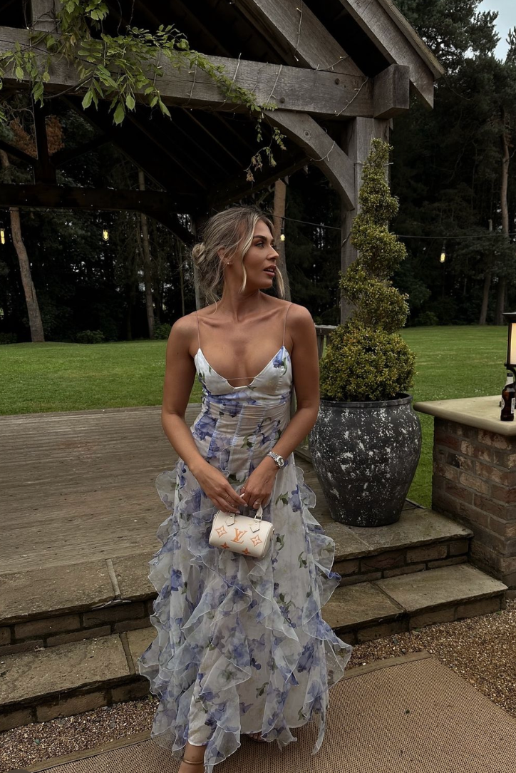 Blue floral ruffled maxi dress with spaghetti straps and tiered, layered skirt
