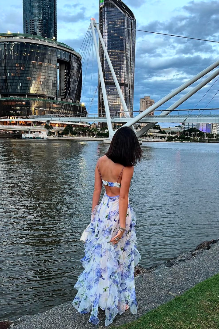 Blue floral ruffled maxi dress with spaghetti straps and open-back silhouette