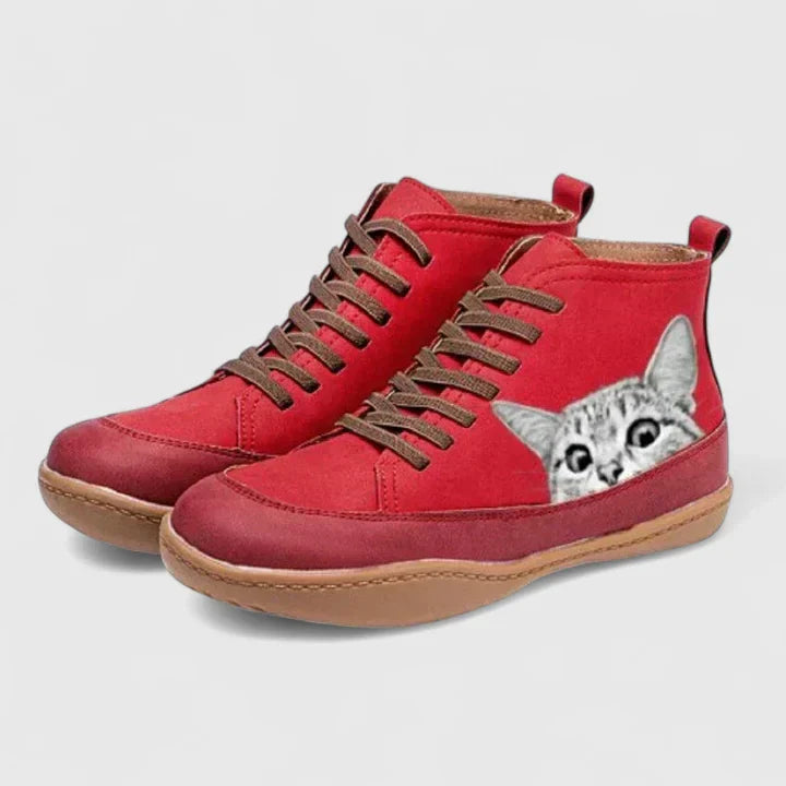 Red lace-up orthopedic boots with gray cat face patch and cushioned sole