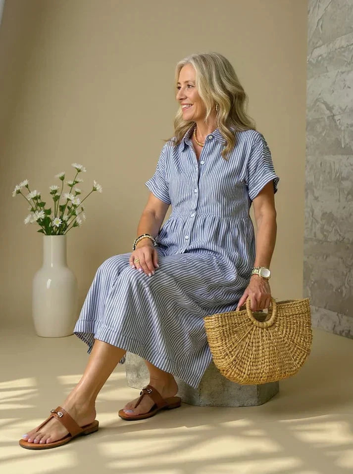 Blue striped shirt dress with short sleeves, button front, and gathered waist midi length
