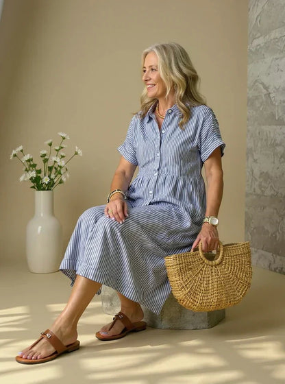 Blue striped shirt dress with short sleeves, button front, and gathered waist midi length