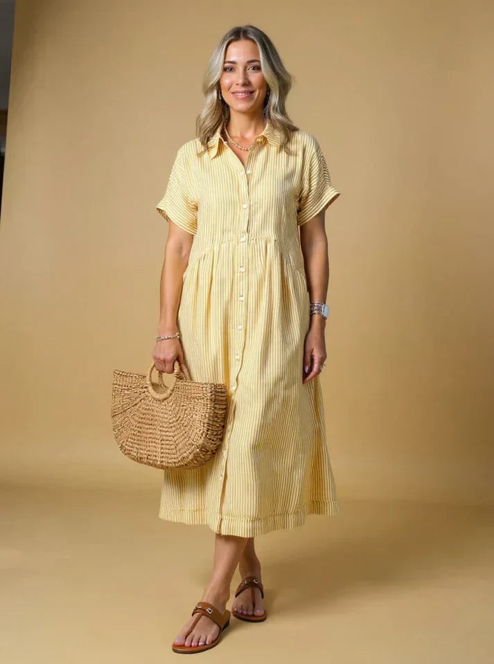 Yellow striped shirt dress with short sleeves, button front, and gathered waist midi length