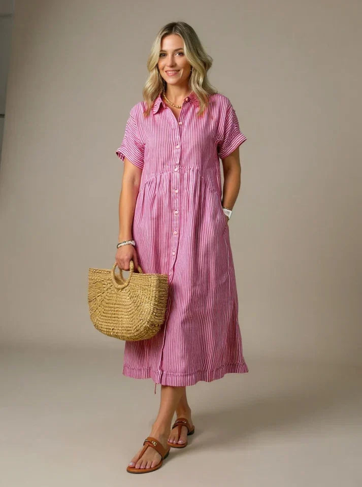 Pink striped shirt dress with short sleeves, button front, and gathered waist midi length