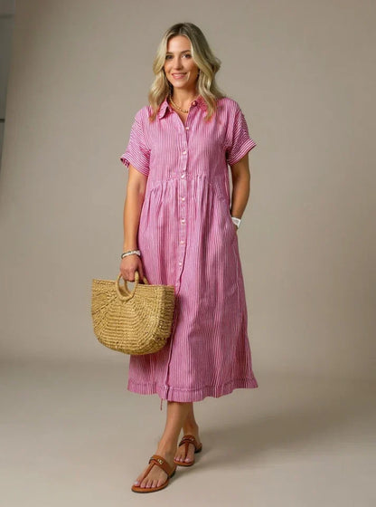 Pink striped shirt dress with short sleeves, button front, and gathered waist midi length