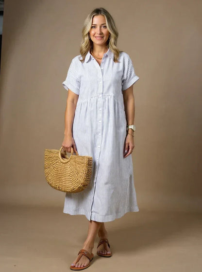 White striped shirt dress with short sleeves, button front, and gathered waist midi length