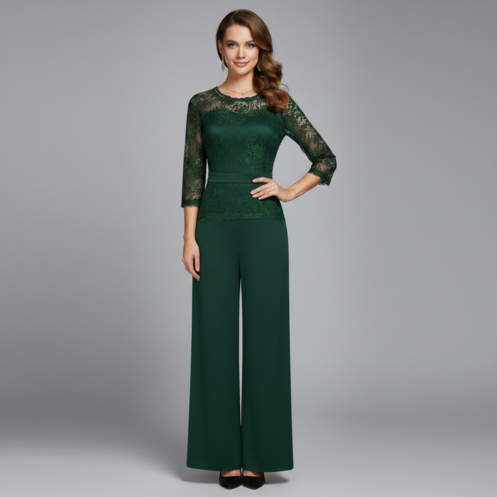 Green lace evening jumpsuit with 3/4 sleeves, round neckline, and wide-leg pants