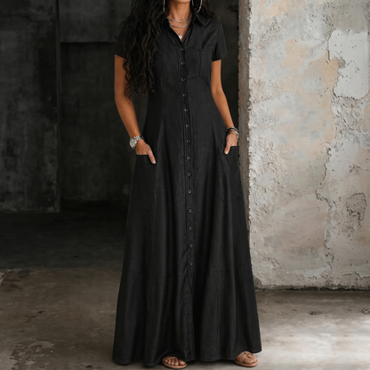 Black long denim dress with short sleeves, button front and gathered skirt