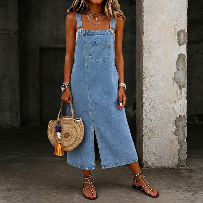 Light blue denim jumper dress with square bib, front pocket, and long front buttons
