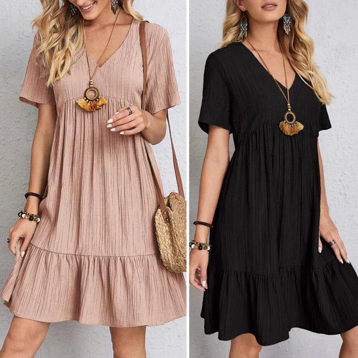 Casual summer dress with V-neck and tiered skirt, shown in blush and black