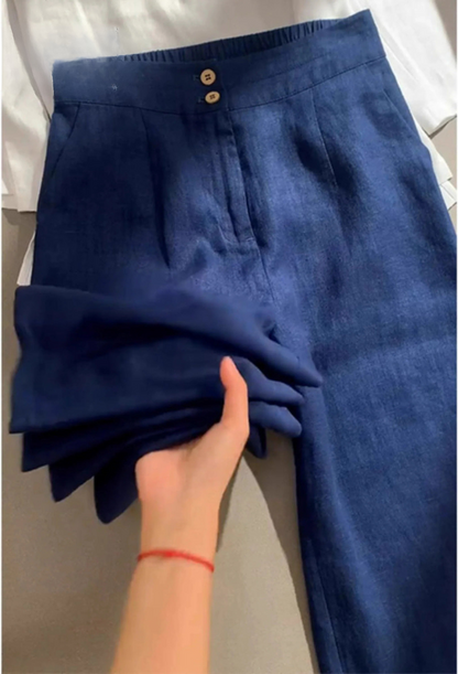 Navy wide-leg pants with buttoned waistband and front pleats