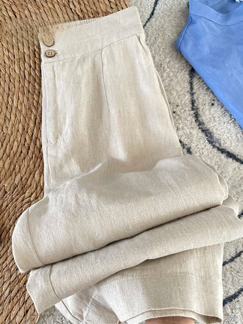 White wide-leg pants with buttoned waistband