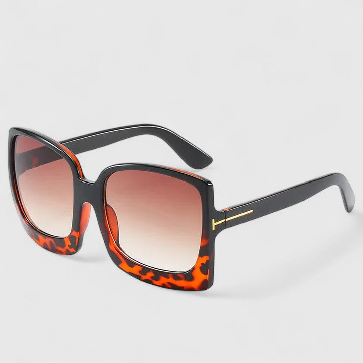 Stylish square sunglasses with orange-red leopard frame and gradient tinted lenses