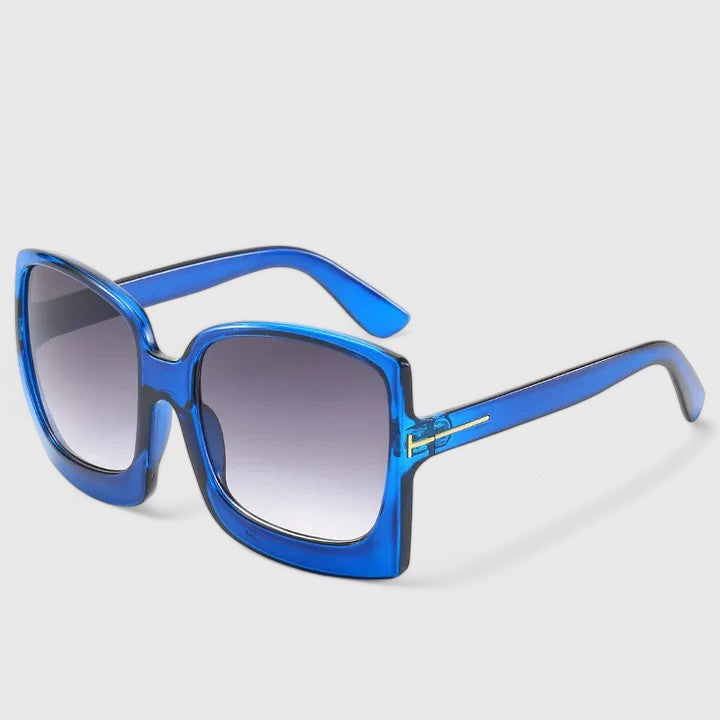 Square blue sunglasses with dark gradient lenses and slim gold-toned bridge detail