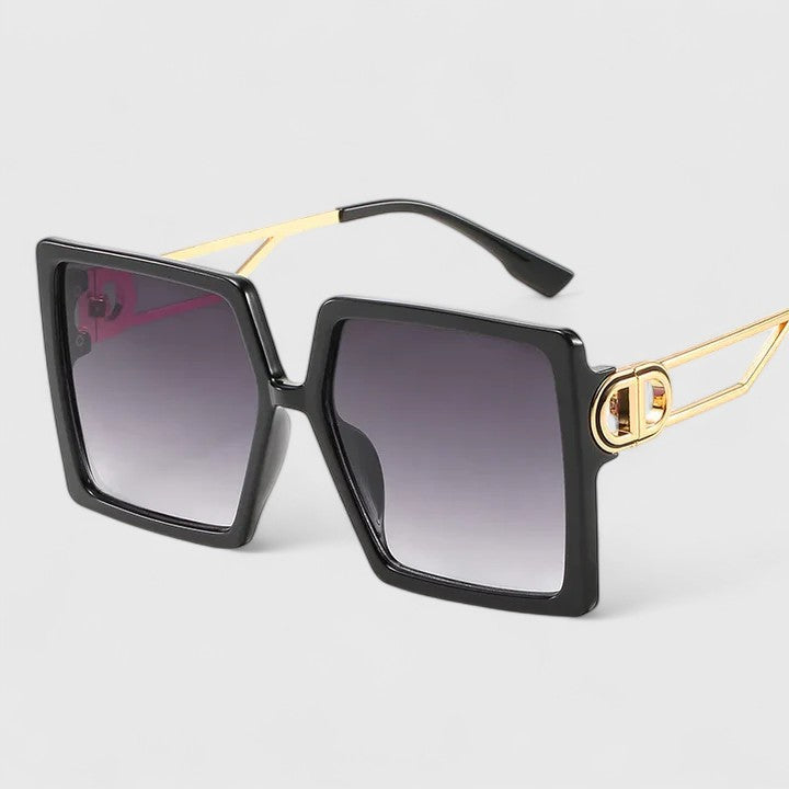 Black square sunglasses with gold temple arms and dark purple gradient lenses