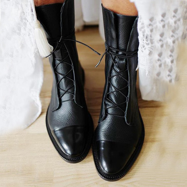 Black lace-up ankle boots with pointed toe and stitched vamp