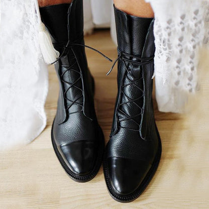 Black lace-up ankle boots with pointed toe and stitched vamp