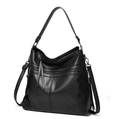 Black hobo shoulder bag with front zip pockets and two adjustable shoulder straps