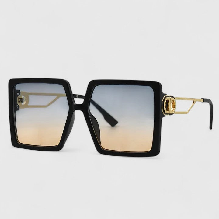 Black square sunglasses with gold metal temple arms and tinted lenses