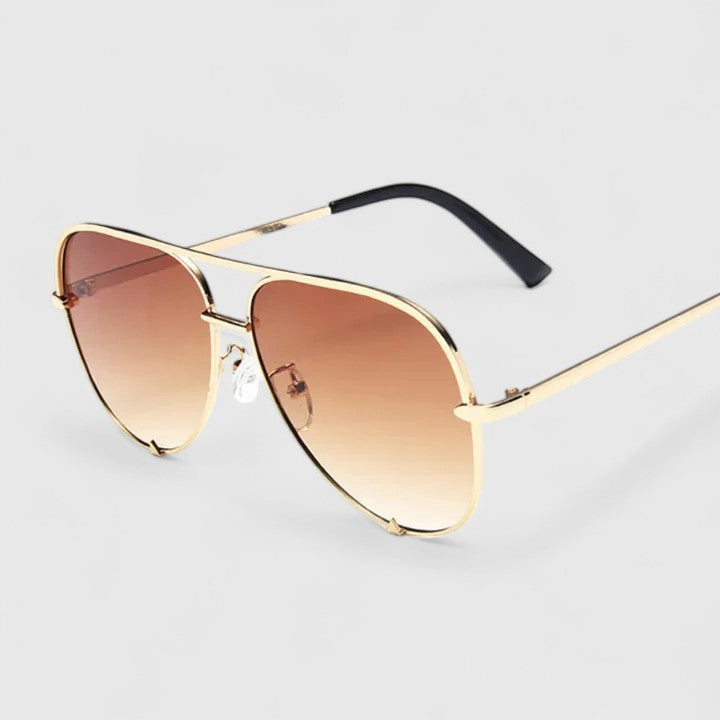 Gold sunglasses with light-brown gradient lenses and slim aviator-style frames
