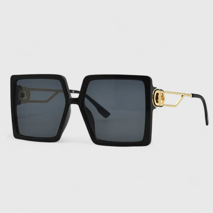 Black square sunglasses with gold emblem and dark blue-gray tinted lenses