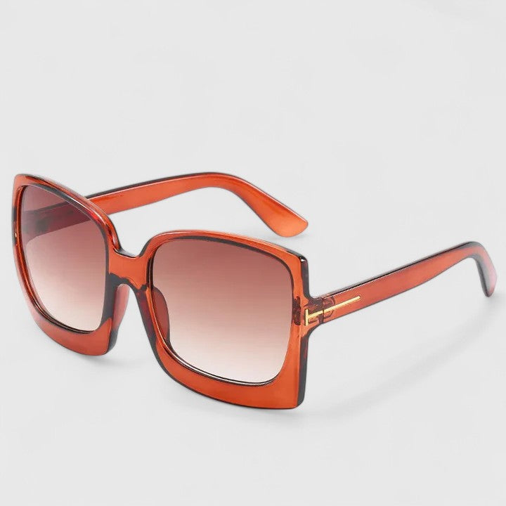 Square orange sunglasses with brown gradient lenses and slim gold-toned side accents