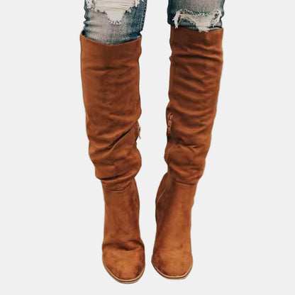 Brown slouchy heeled knee-high boots with stacked block heel and pointed toe