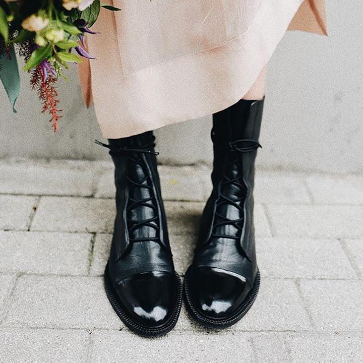 Black lace-up ankle boots with rounded toe and chunky platform sole