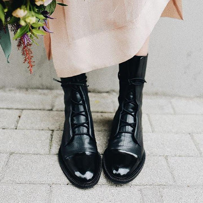Black lace-up ankle boots with rounded toe and chunky platform sole