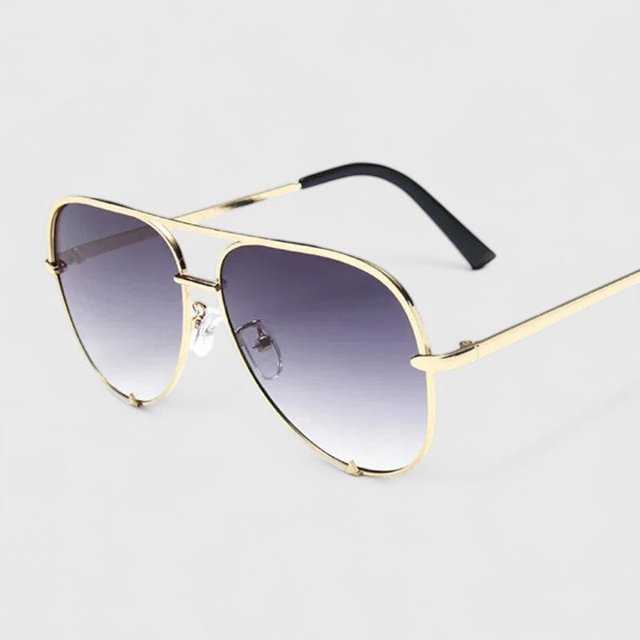 Gold sunglasses with gradient purple lenses and thin aviator-style frames