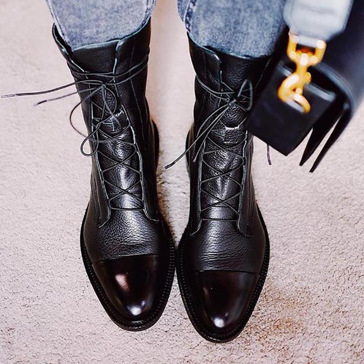 Black lace-up ankle boots with glossy finish and thick rubber sole