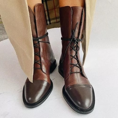 Brown lace-up ankle boots with side seam panels and thick sole