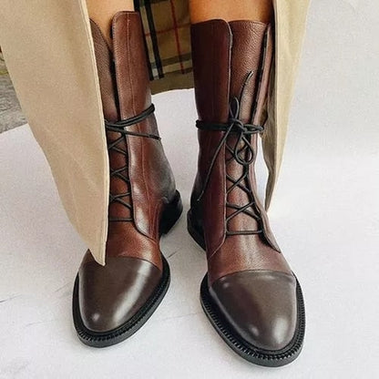 Brown lace-up ankle boots with side seam panels and thick sole