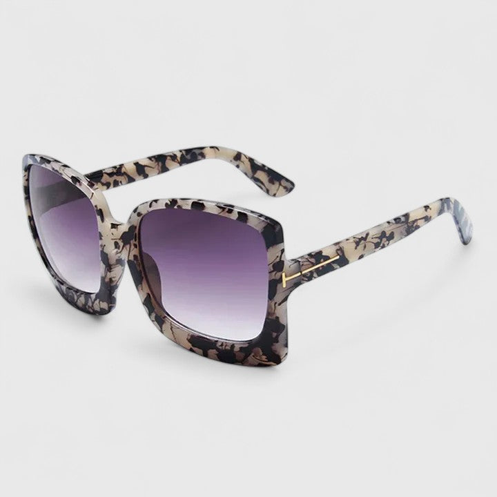 Square leopard print sunglasses with dark gradient lenses and gold-toned bridge detail