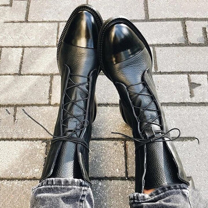 Black lace-up boots with rounded toe and chunky sole, front view