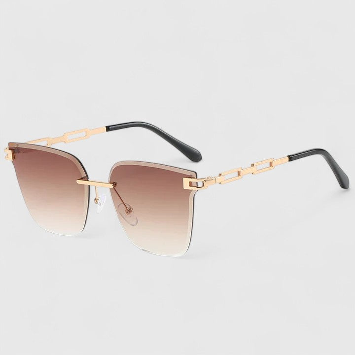 Sophisticated sunglasses with rose-brown gradient lenses and gold frame with black temples