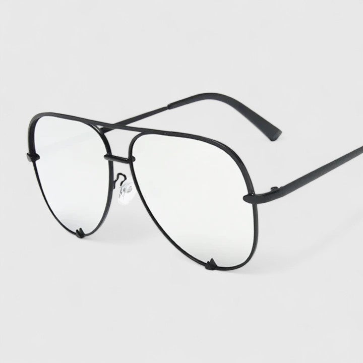 Black sunglasses with clear light lenses and slim aviator-style frames