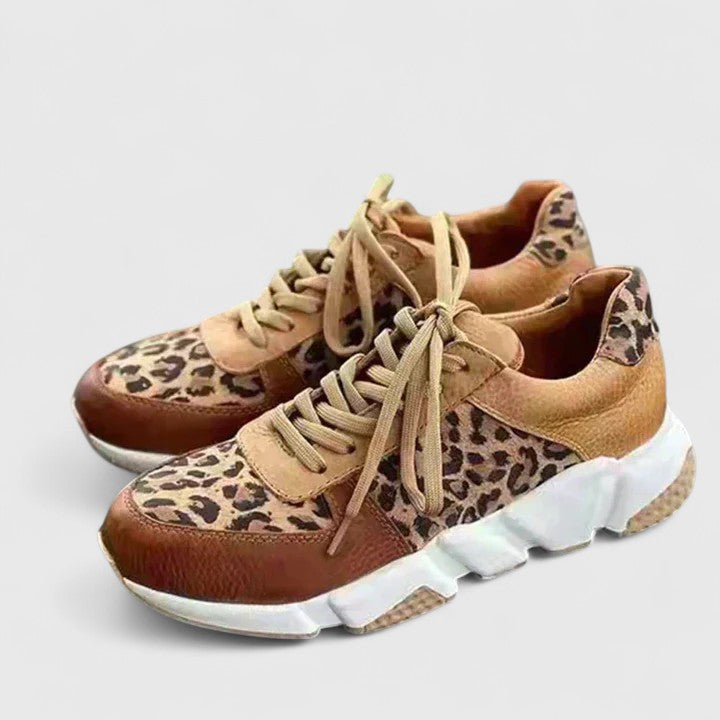 Leopard-print sneakers with tan and brown upper, tan laces, thick white sole