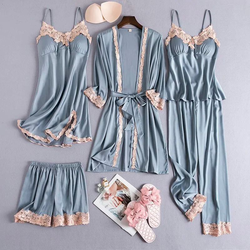 Women’s blue nightwear set with lace-trim robe, cami, and ruffled lace shorts
