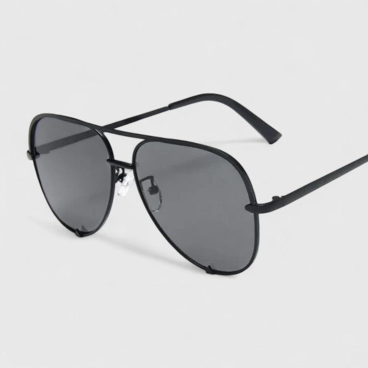 Black cat-eye sunglasses with dark gray lenses and slim arms
