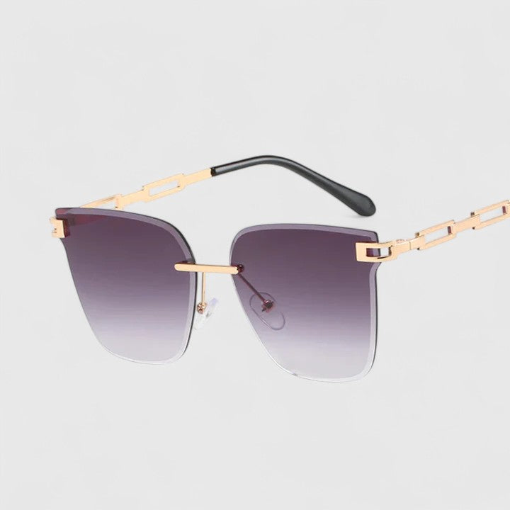 Sophisticated sunglasses with purple gradient lenses and gold metal frame bar