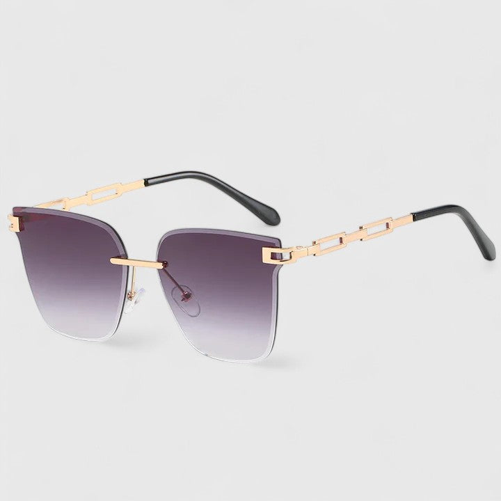 Sophisticated sunglasses with purple gradient lenses and gold metal bridge bar, black temples